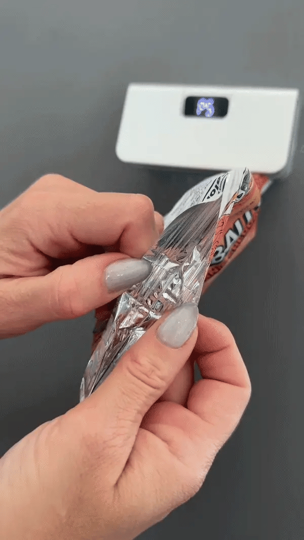 Magnetic Bag Sealer sealing an opened snack bag